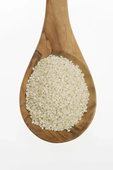 Framed Print : Sesame (Sesamum indicum) seeds on an olive wood spoon Framed Print : Sesame (Sesamum indicum) seeds on an olive wood spoon