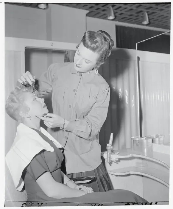 Framed Print : Sex Changed Artist Applying Makeup to Customer Framed Print : Sex Changed Artist Applying Makeup to Customer