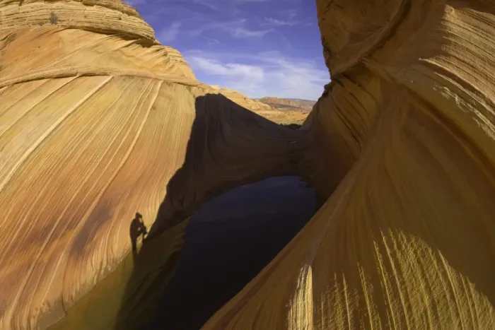 Framed Print : Shadow of man photographing scenic sandstone Framed Print : Shadow of man photographing scenic sandstone