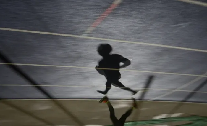 Framed Print : Shadow of a man running in sports stadium Framed Print : Shadow of a man running in sports stadium