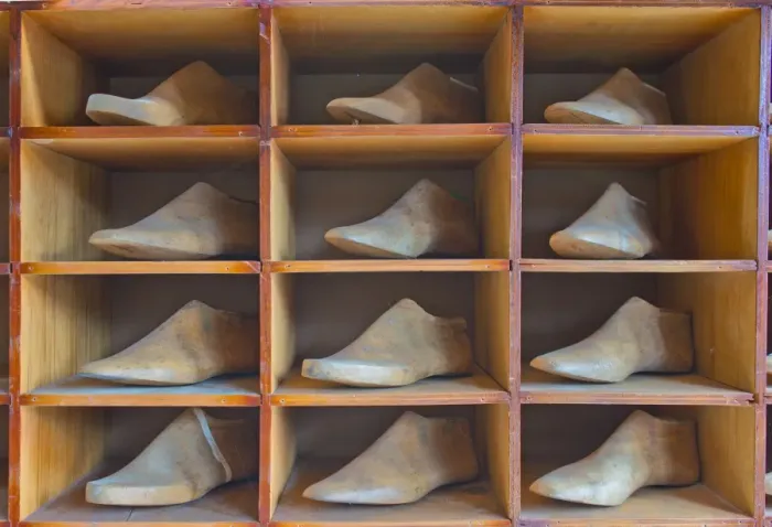 Framed Print : Shelf with antique lasts for manufacturing shoes Framed Print : Shelf with antique lasts for manufacturing shoes