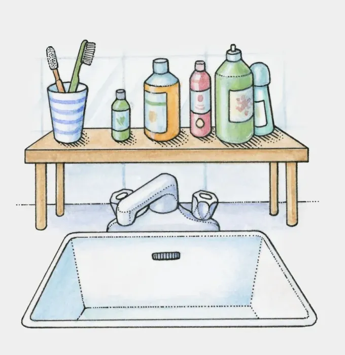 Framed Print : A shelf over a sink holding bottles and toothbrushes