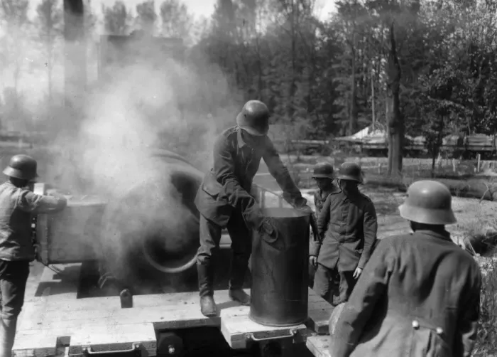 Framed Print : Shellcase. circa 1917: A German gunner removing an empty shellcase from a howitzer Framed Print : Shellcase. circa 1917: A German gunner removing an empty shellcase from a howitzer