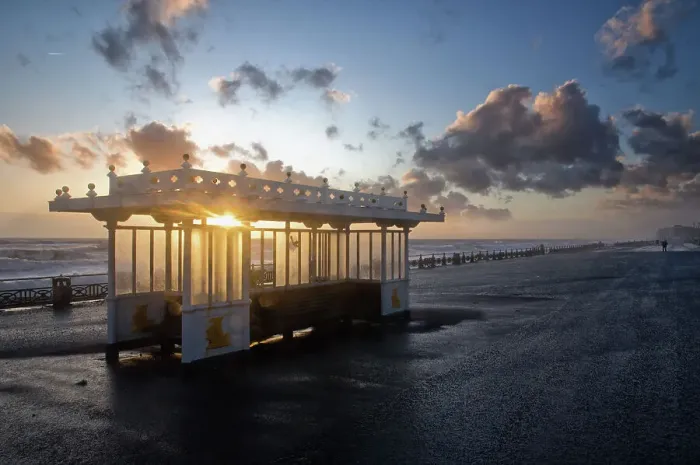 Framed Print : Shelter. Victorian shelter on the promenade of Hove seafront just after rainfall