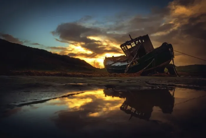 Framed Print : Shipwreck on beach at sunset Framed Print : Shipwreck on beach at sunset