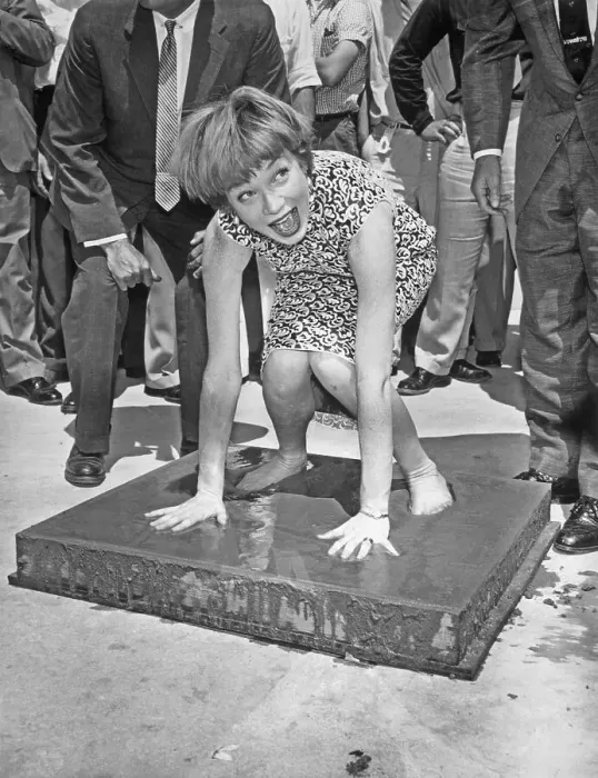 Framed Print : Shirley MacLaine Placing Hands in Wet Cement Framed Print : Shirley MacLaine Placing Hands in Wet Cement