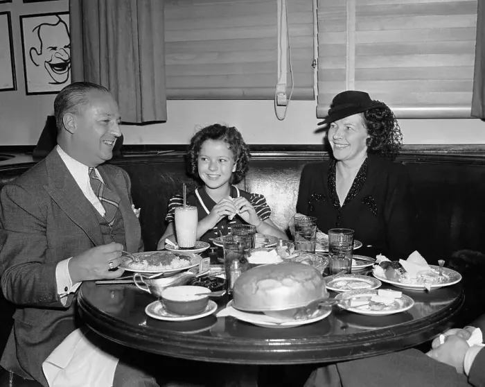Framed Print : Shirley Temple and Her Parents at Dinner Table Framed Print : Shirley Temple and Her Parents at Dinner Table