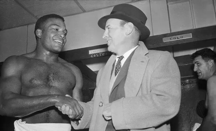 Framed Print : Shirtless Jim Brown Shakes Coach's Hand Framed Print : Shirtless Jim Brown Shakes Coach's Hand