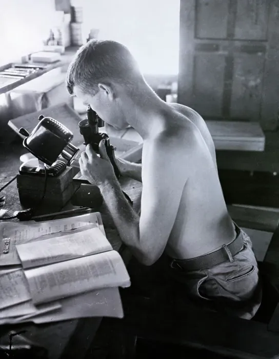 Framed Print : Shirtless Man Looking Into Microscope
