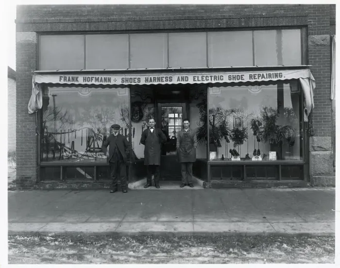 Framed Print : Shoe Repair Shop Exterior and Workers Framed Print : Shoe Repair Shop Exterior and Workers