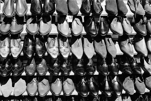 Shoe Shop. 22nd October 1963: A stall selling shoes in Londons Petticoat Lane Market