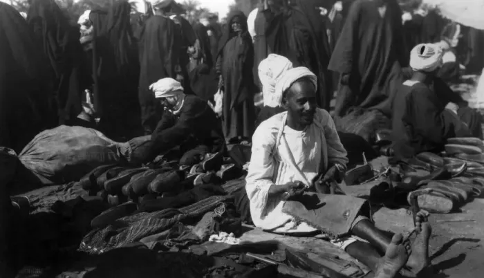 Framed Print : Shoemaker. circa 1930: An Egyptian shoe maker plies his trade in the marketplace Framed Print : Shoemaker. circa 1930: An Egyptian shoe maker plies his trade in the marketplace