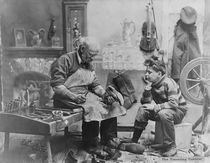 Framed Print : Shoemaker Preparing Shoes for Young Boy Framed Print : Shoemaker Preparing Shoes for Young Boy
