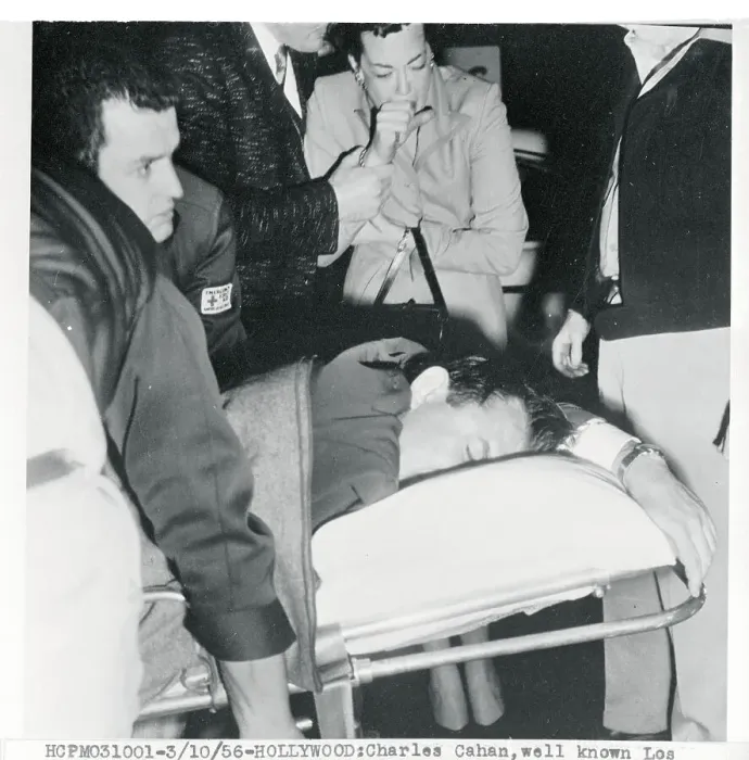 Framed Print : Shooting victim Being Moved to Hospital