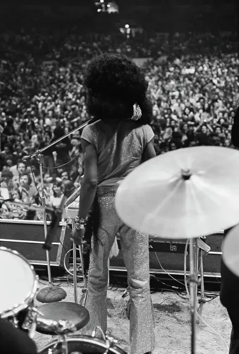 Framed Print : Showtime. Performer Sly Stone in glittery trousers surveys the crowd at a concert Framed Print : Showtime. Performer Sly Stone in glittery trousers surveys the crowd at a concert