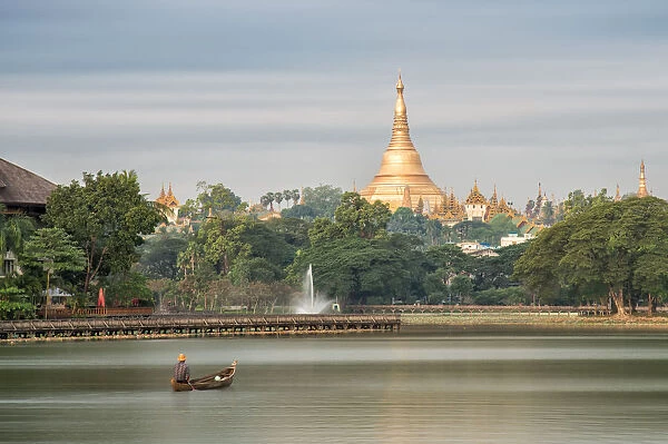 Shwedagon Pagoda in the morning view at wooden boardwalk at the Kandawgyi Lake in Yangon, Myanmar