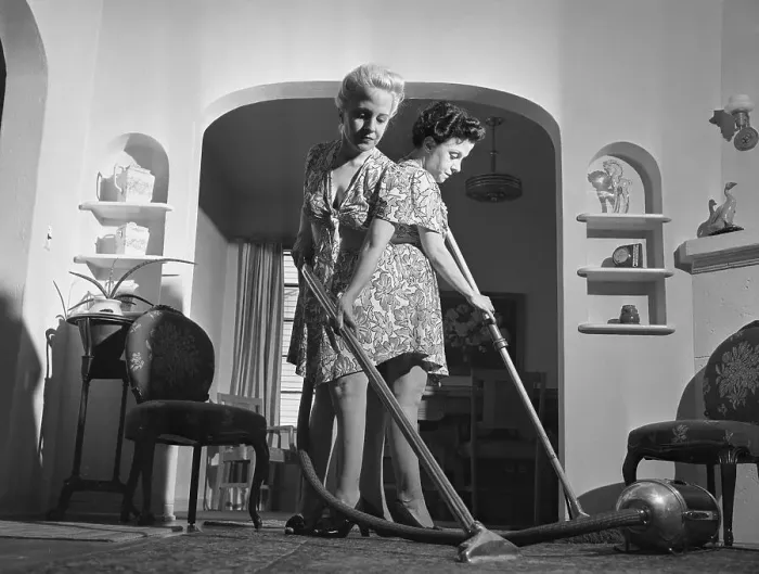 Framed Print : Siamese Twins Vacuuming at Home Framed Print : Siamese Twins Vacuuming at Home