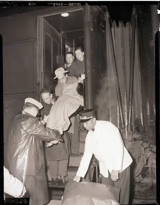 Framed Print : Sick Passenger Taken from Rescue Train