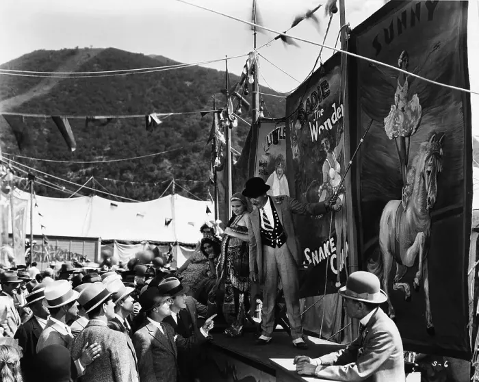 Framed Print : Sideshowman Selling Tickets to Men Framed Print : Sideshowman Selling Tickets to Men