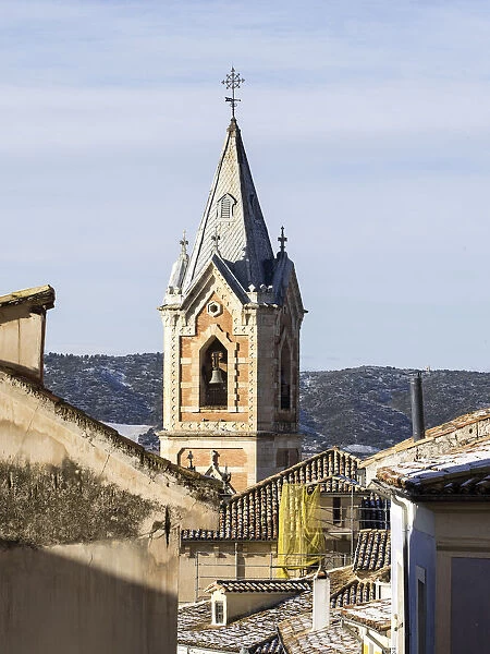 Sight of the Tower of the church of the Salvador in Cuenca, from inside an alley