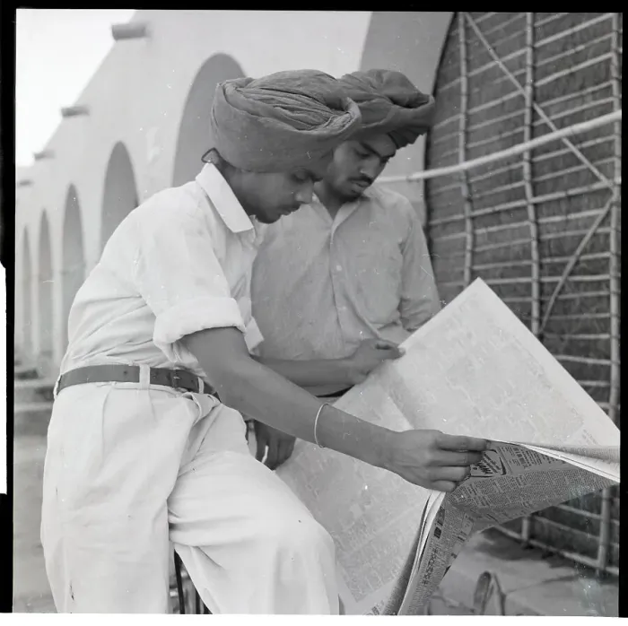 Framed Print : Sikh Men Search Newspaper For Jobs Framed Print : Sikh Men Search Newspaper For Jobs