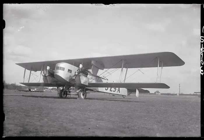 Framed Print : Sikorsky Commercial Airplane Parked in a Field