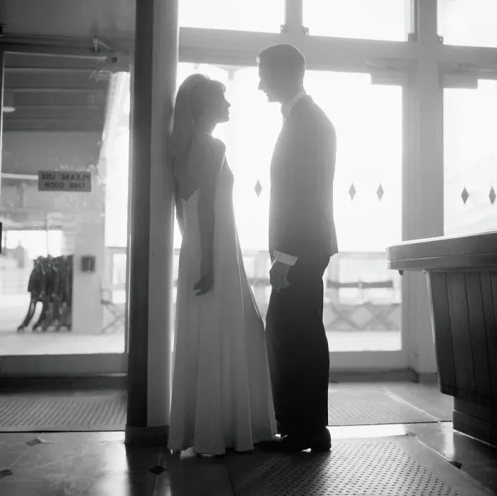 Framed Print : Silhouette of couple aboard ship, wearing formal dress, with sunlight shining through in background Framed Print : Silhouette of couple aboard ship, wearing formal dress, with sunlight shining through in background