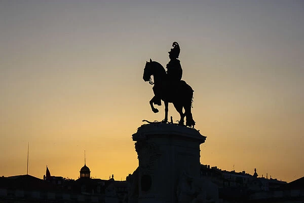 Silhouette of the equestrian statue of Jose I at sunset, Praca do Comercio, Lisbon, Portugal