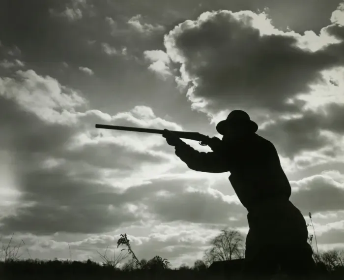 Framed Print : Silhouette of man aiming shotgun outdoors Framed Print : Silhouette of man aiming shotgun outdoors