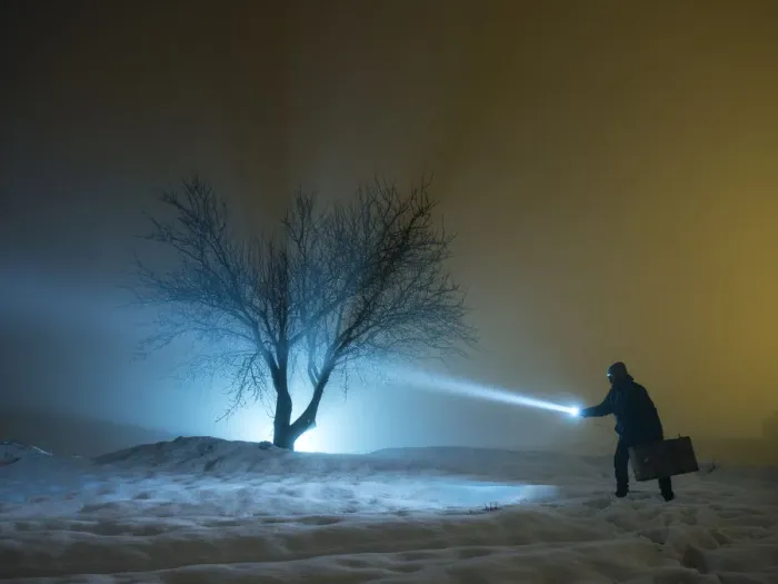 Framed Print : Silhouette of a person walking with a suitcase and a lantern, for a covered way of snow and fog during the night Framed Print : Silhouette of a person walking with a suitcase and a lantern, for a covered way of snow and fog during the night