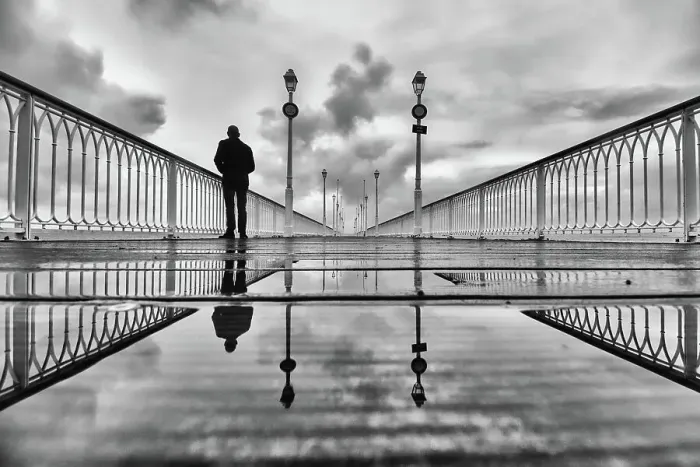 Framed Print : Silhouette on a pier on a rainy winter morning Framed Print : Silhouette on a pier on a rainy winter morning