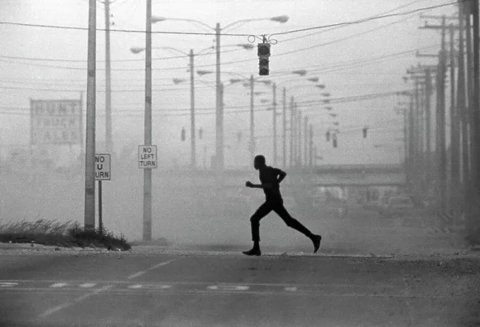 Framed Print : Silhouetted Man Running Across Tear Gassed Street Framed Print : Silhouetted Man Running Across Tear Gassed Street