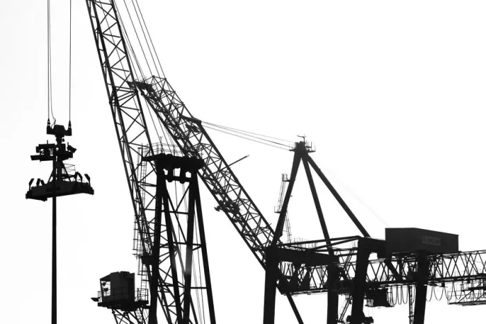 Framed Print : Silhouetted profile of construction cranes Framed Print : Silhouetted profile of construction cranes
