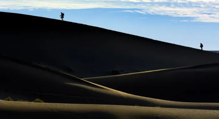 Framed Print : Silhouettes of people climbing a dune, desert landscape, Namib, Hardap Region, Namibia Framed Print : Silhouettes of people climbing a dune, desert landscape, Namib, Hardap Region, Namibia