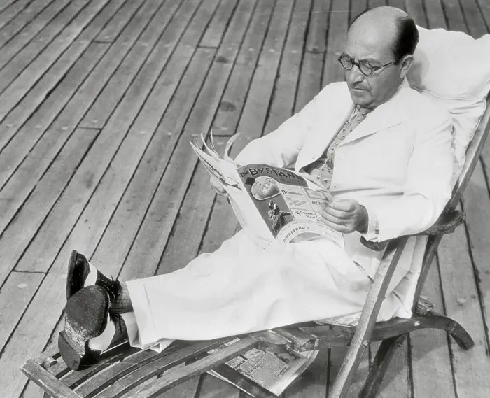 Framed Print : Sir Montague Burton Reading Magazine in Deck Chair Framed Print : Sir Montague Burton Reading Magazine in Deck Chair
