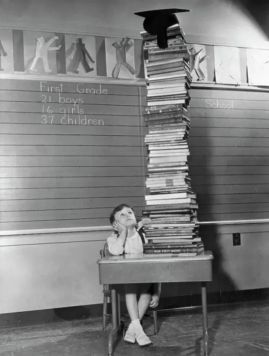 Framed Print : Six-Year-Old Peggy Wolverton Staring at School Books Framed Print : Six-Year-Old Peggy Wolverton Staring at School Books