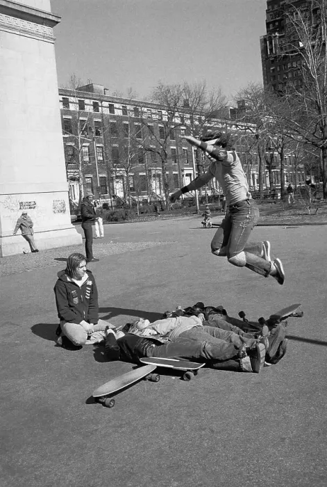 Framed Print : Skateboarder Jumping over People onto Skateboard Framed Print : Skateboarder Jumping over People onto Skateboard