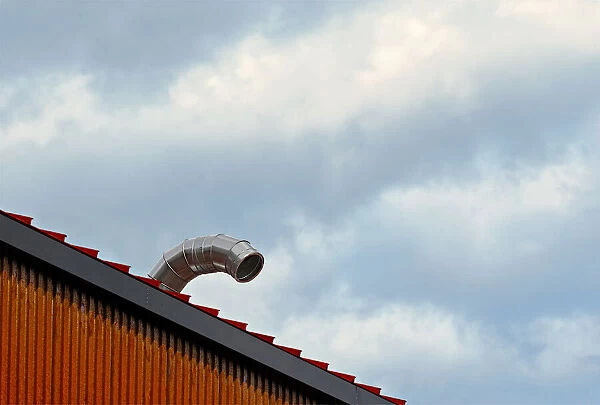Sky Duct. A color photograph of the roof to a metal commercial building