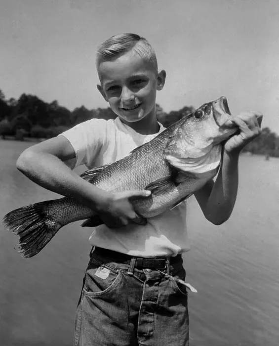 Framed Print : Small Boy Holding Large Fish Framed Print : Small Boy Holding Large Fish