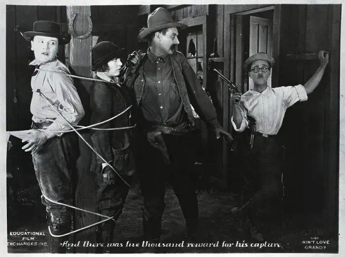 Framed Print : Small Cowboy Catches Large Cowboy