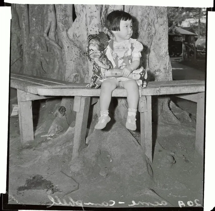 Framed Print : Small Girl Sitting on Bench with Doll Framed Print : Small Girl Sitting on Bench with Doll