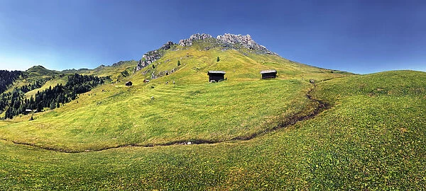 Small spring at Mt Peitlerkofel, Sasso delle Putia, with mountain hut, Villnoess, Funes, Dolomites, South Tyrol, Italy, Europe