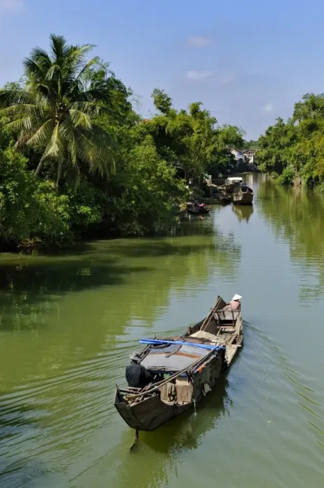 Framed Print : Small wooden motorboat passing through a water channel surrounded by tropical vegetation, Hue, Vietnam, Asia Framed Print : Small wooden motorboat passing through a water channel surrounded by tropical vegetation, Hue, Vietnam, Asia