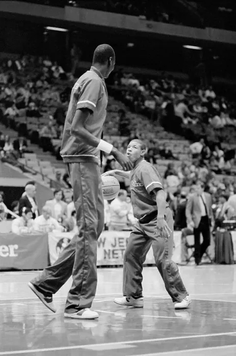 Framed Print : Smallest and Largest Basketball Players Practicing on the Court
