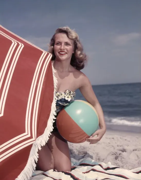 Framed Print : Smiling Blonde Woman Bathing Suit Hold Beach Ball Kneel In Sand By Red Sun Umbrella Framed Print : Smiling Blonde Woman Bathing Suit Hold Beach Ball Kneel In Sand By Red Sun Umbrella
