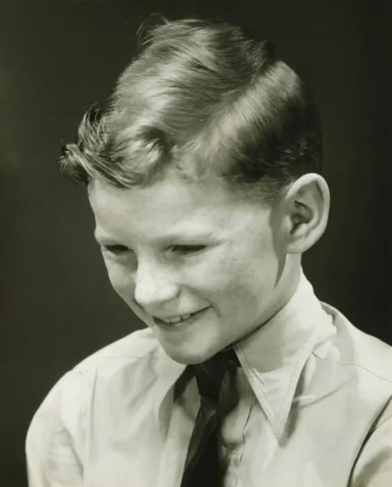 Framed Print : Smiling boy (10-11) posing in studio, (B&W), portrait Framed Print : Smiling boy (10-11) posing in studio, (B&W), portrait