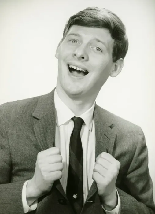 Framed Print : Smiling man with clenched fists in studio, (B&W), portrait Framed Print : Smiling man with clenched fists in studio, (B&W), portrait