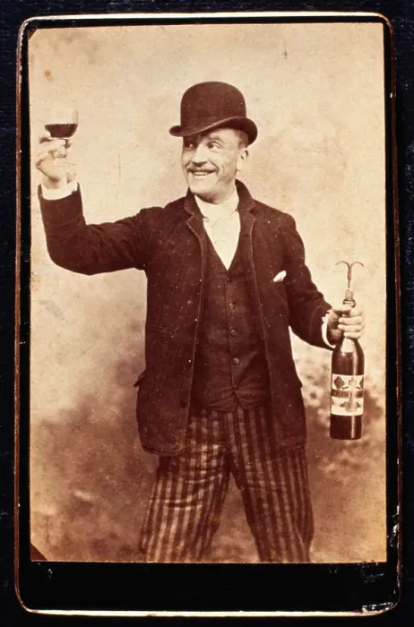 Framed Print : Smiling Man Holding a Wineglass and Wine Bottle Framed Print : Smiling Man Holding a Wineglass and Wine Bottle