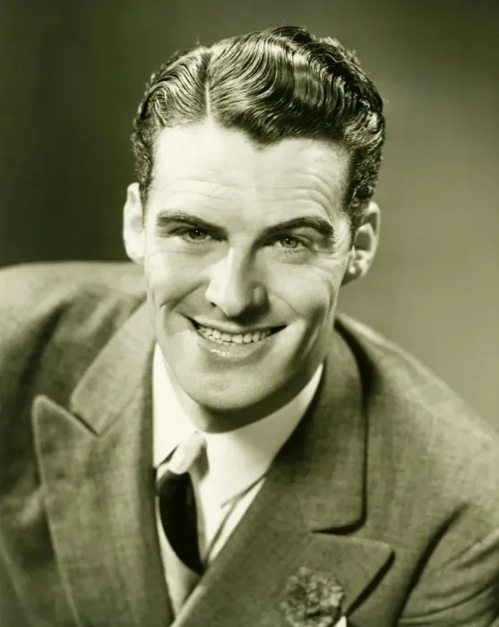 Framed Print : Smiling man posing in studio, (B&W), close-up, portrait