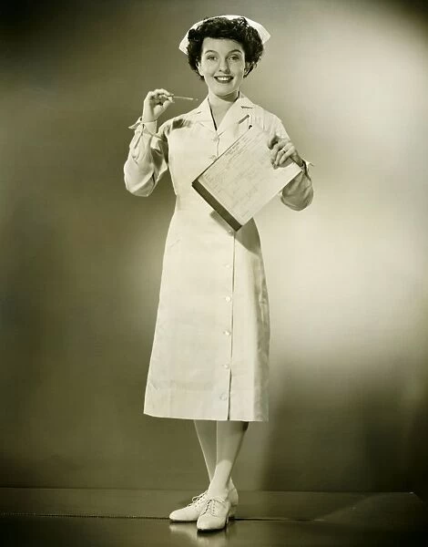 Smiling nurse holding thermometer and files in studio, (B&W), portrait